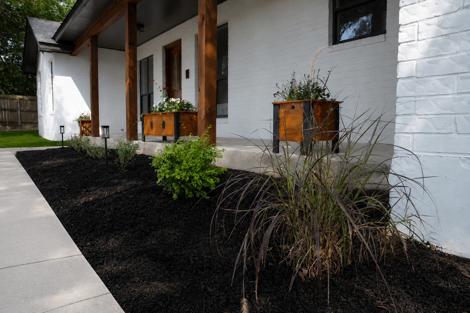 Landscaped front garden leading to the covered porch